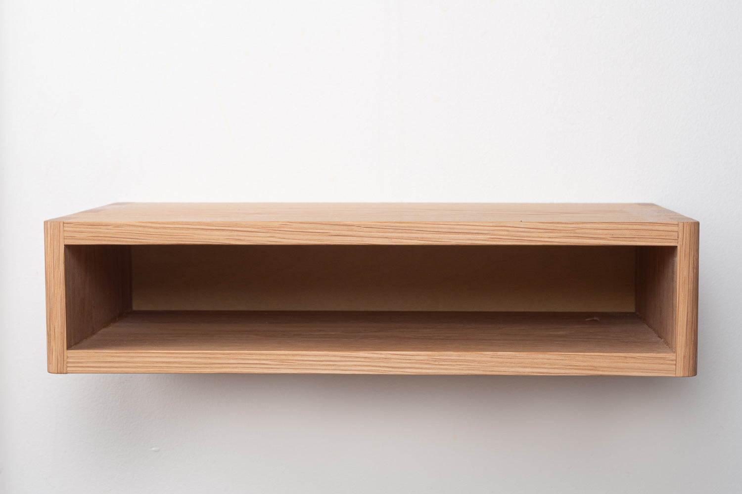 Mesa Bedside Shelf in White Oak pictured in front view. Designed and made by Hey, Porter.
